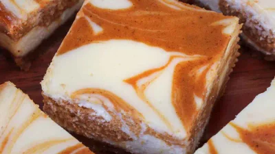 The Best Pumpkin Swirl Cheesecake Bars